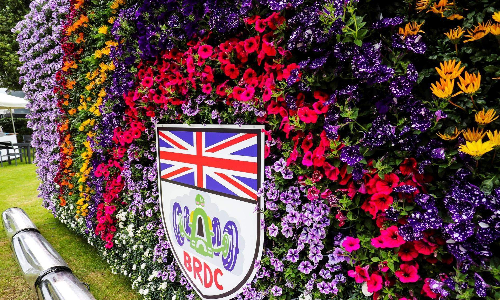 This is an image of a rainbow wall of plants with BRDC logo signage displayed in the centre.